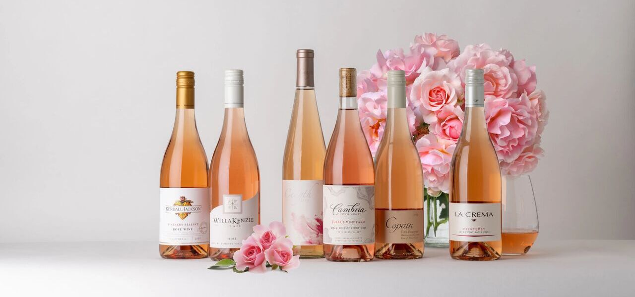 A lineup of Ros&eacute; wines with flowers